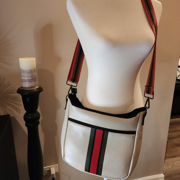 Haute Shore Neoprene cross body bag light beige with black and red accents. - Picture 2 of 3